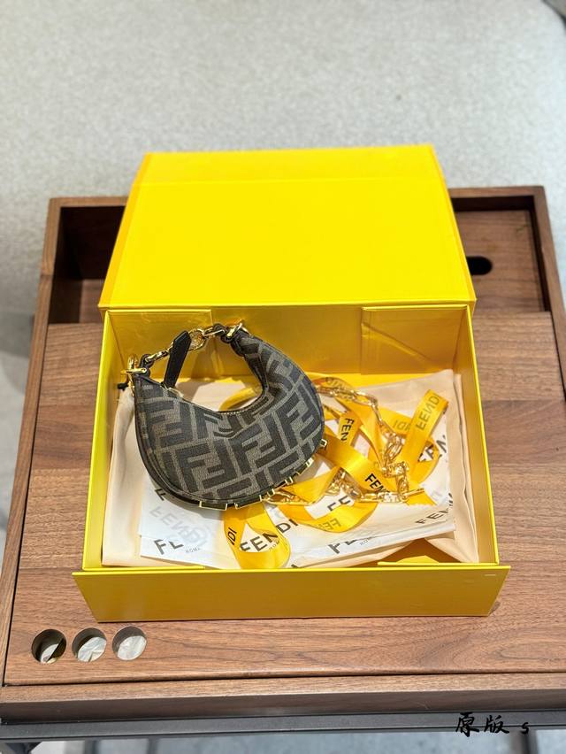 Fendi Graphy series metal logo adjustable wrist and underarm bag. This bag is ba