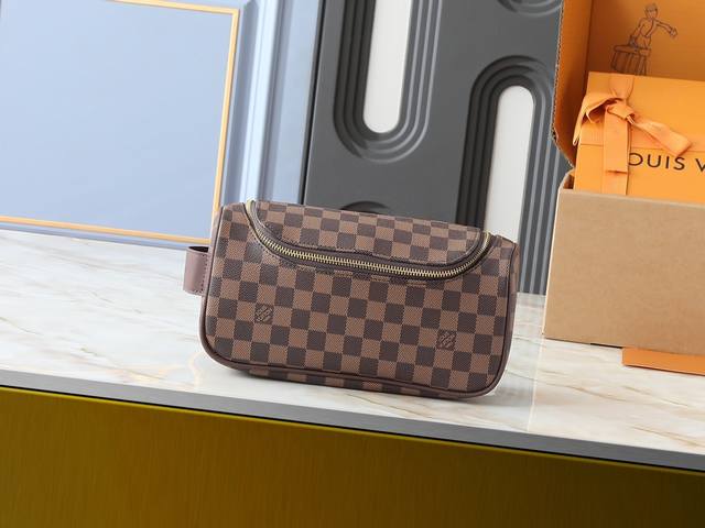 Upgraded original M11510 This vanity bag is made of Damier Graphite canvas, whi