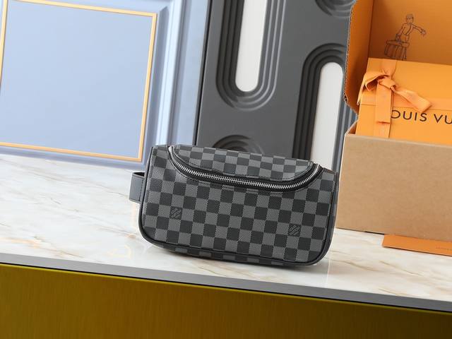 Upgraded original M11510 This vanity bag is made of Damier Graphite canvas, whi