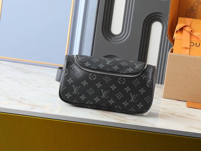 Upgraded original M11510 This vanity bag is made of Damier Graphite canvas, whi