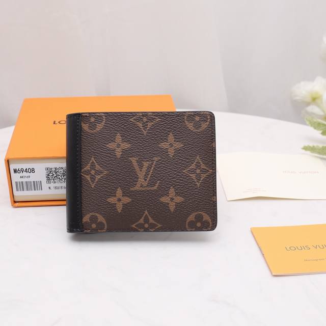 M69408 Monogram Short Wallet This Multiple Wallet is made of Monogram Macassar m