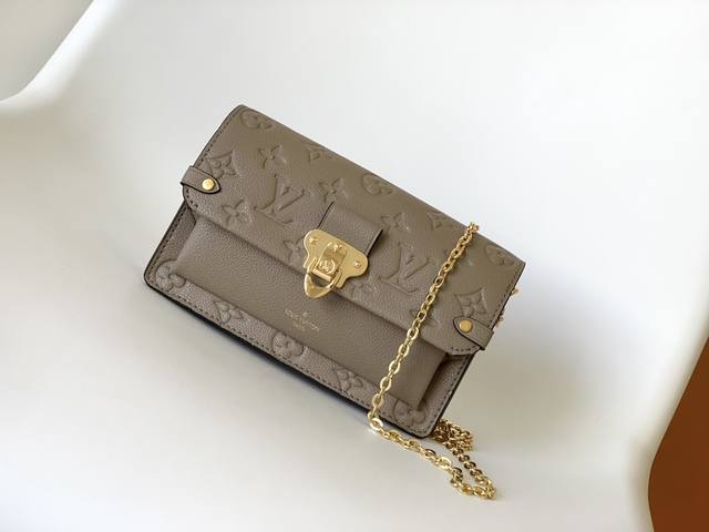 M67839BlackM69423ApricotTop Original This Vavin wallet is made of Monogram Empre