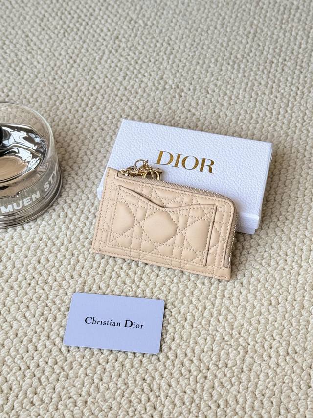 Lady Dior card holder sand color. I bought this wallet to fit my waste bag. It h