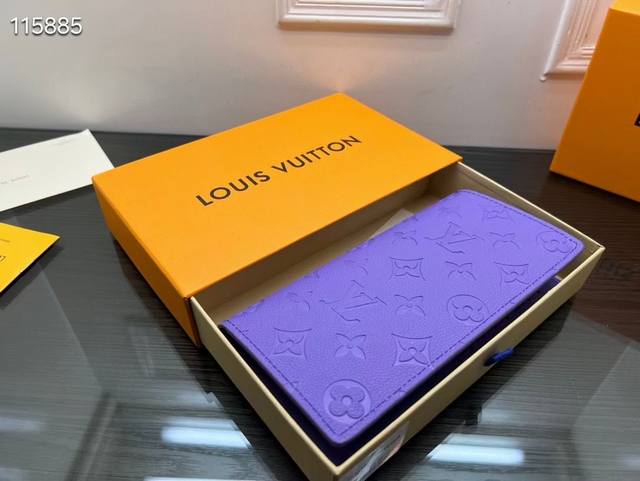 M81546 The purple short clip Multiple wallet has a clean and simple design. The