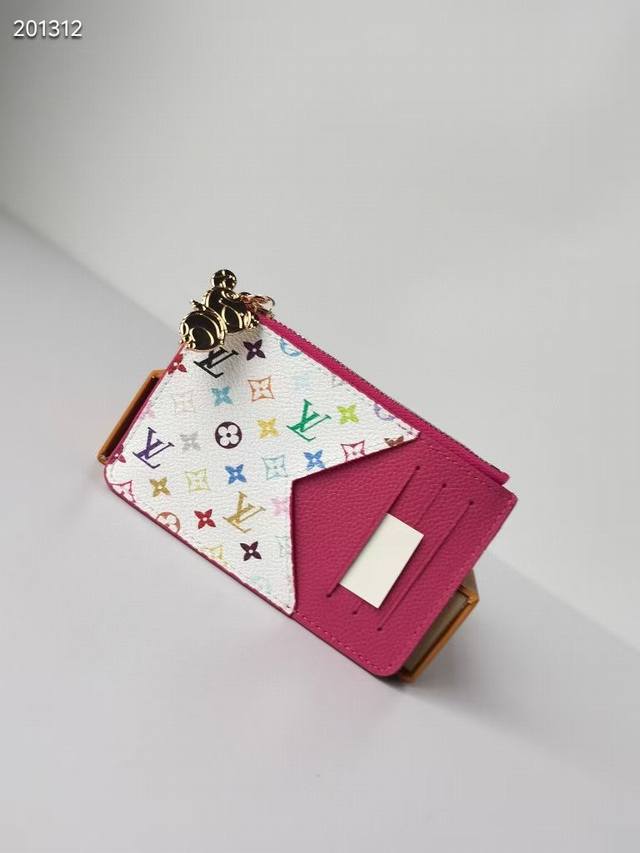 Style No.: 13800 Rose 81912 This Romy cardholder is part of the Louis Vuitton x