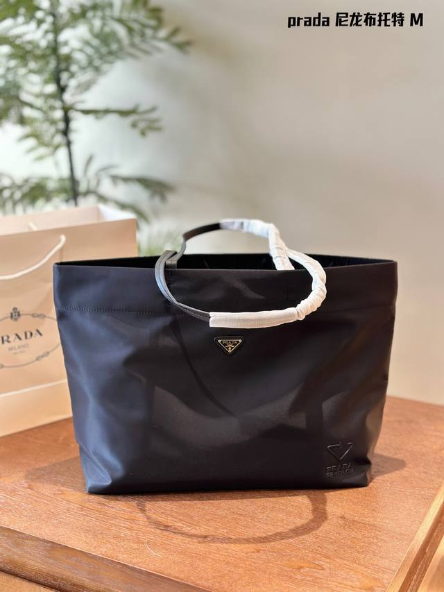 Prada. Comes with box This medium tote bag is made of innovative recycled nylon