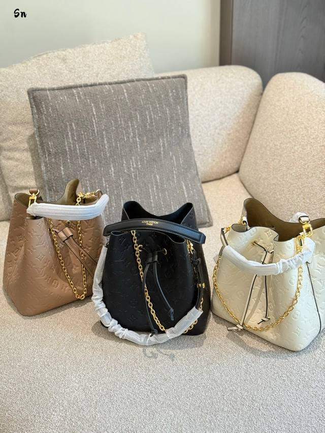 Lv embossed bucket bag 22