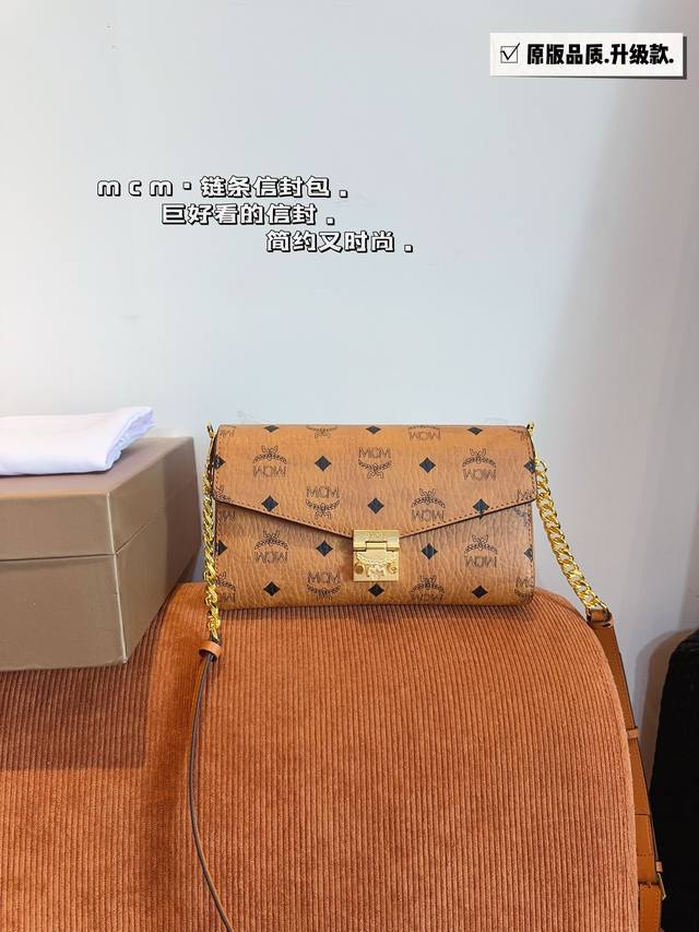 with gift box. Mcm Woc envelope bag. chain stitching leather shoulder strap. st