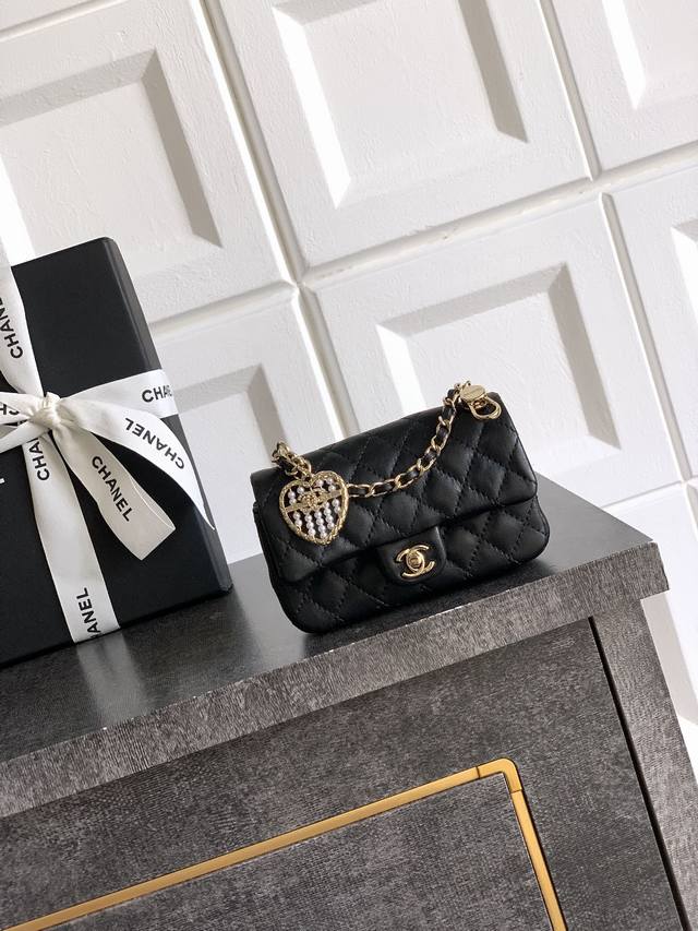 Chanel 25A Mini Heart Pearl Cf Pendant Small Leather Goods. Available in burgund