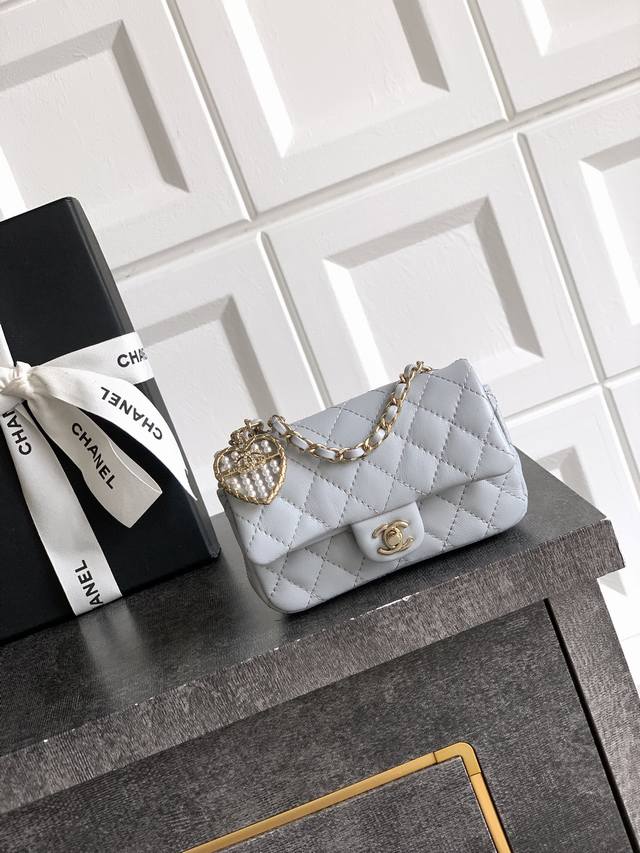 Light Gray Ohanel 25A Mini Heart Pearl Cf Pendant Small Leather Goods. Available