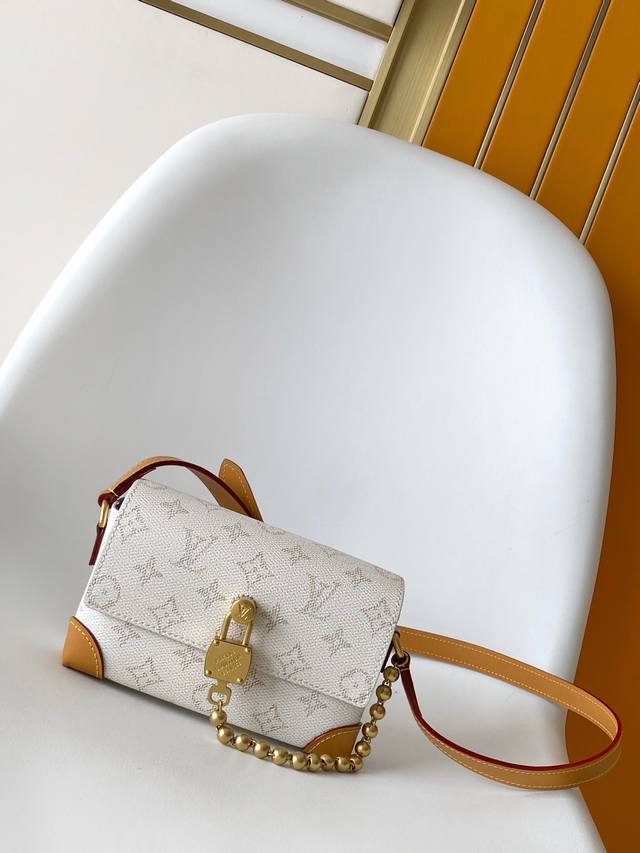 M14686 White Flower M14923 Black Grid This Steamer mini bag showcases Pharrell W