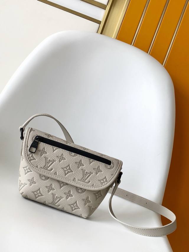 M14794 This original gray tonal Pulse mini handbag is crafted from Monogram Shad