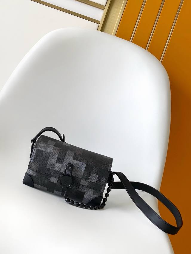 M14923 This Steamer mini bag showcases Pharrell Williams' elegant and sophistica