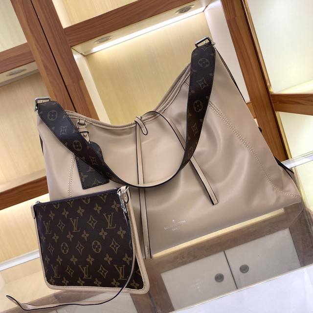M25143, M46197 Large Louis Vuitton introduces the new Carryall Medium handbag, f