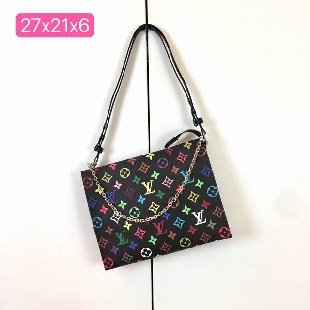 M13746, M13907, Pochette Voyage Dnsnh Medium Handbag is made of the new iconic b