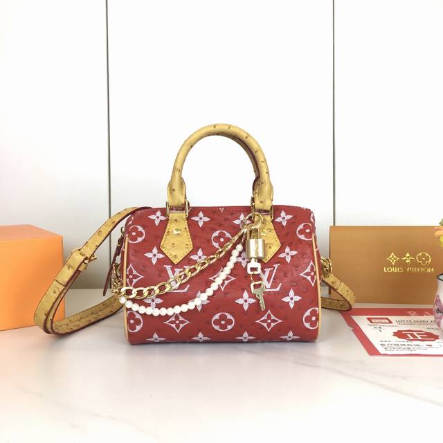 Ostrich print, M87682. This Lv x Yk Nano Speedy bag embodies the infinity polka