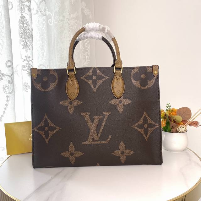 M45321! The Onthego Medium Handbag features classic Monogram canvas and Monogram