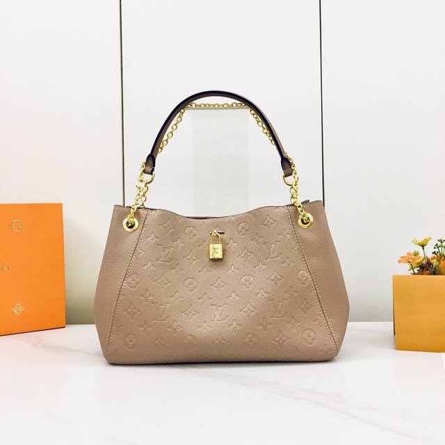 M14659, M14414 This Anytime handbag harkens back to the Promenade handbag, first