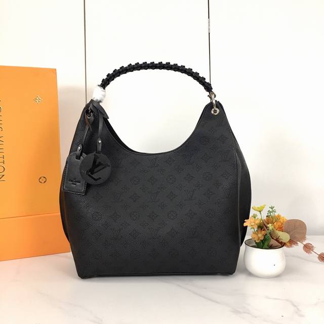 53188. This bag is crafted from imported grained Taurillon calfskin! Its stylish
