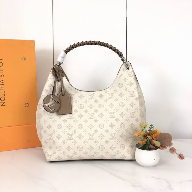 53188. This bag is crafted from imported grained Taurillon calfskin! Its stylish