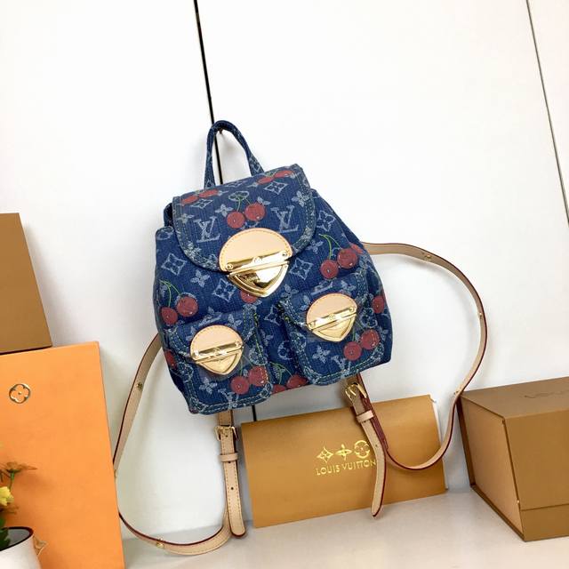 M 13679. This Venice backpack is crafted from coated canvas, featuring a Monogra