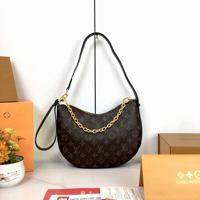 Cookie Bb Single Shoulder Moon Bag M15056. Made from Monogram coated canvas with