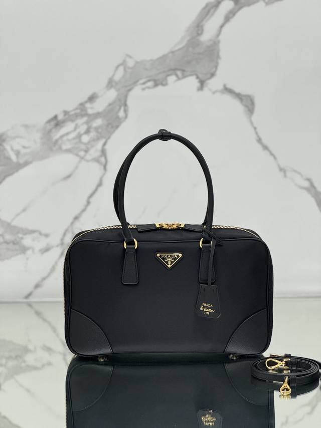 Large Double Handle Bag. Crafted from recycled nylon, this bag incorporates uniq