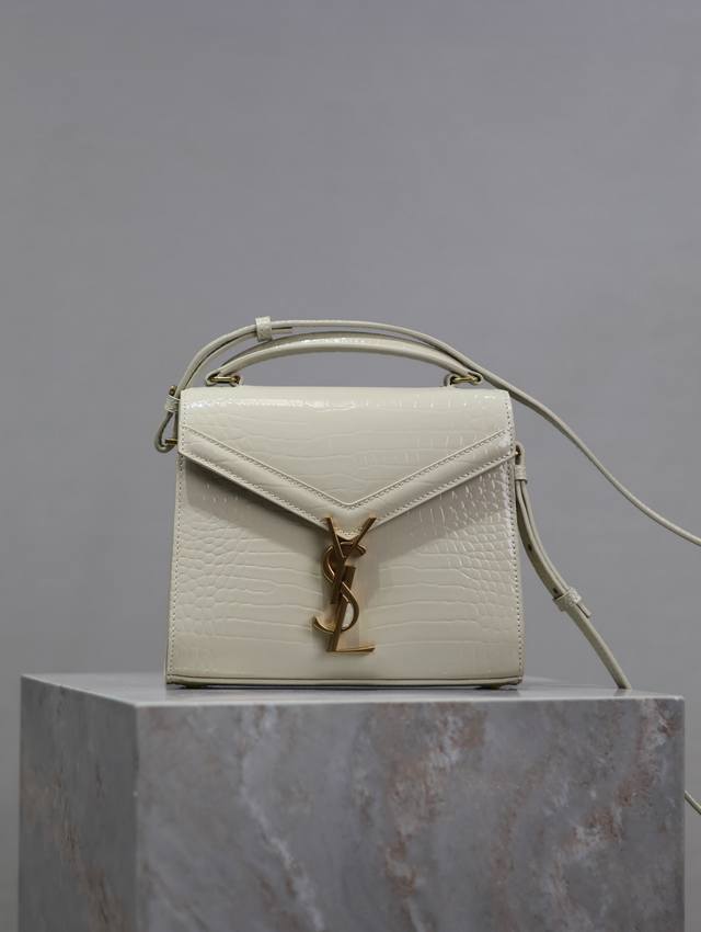 White Cassandra Mini handbag with gold buckle and crocodile pattern! This series