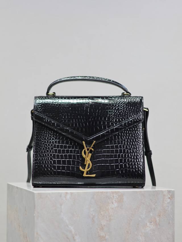 Black gold-buckle crocodile-grain Cassandra briefcase. Made from imported Italia