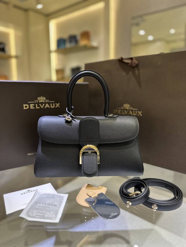 Premium Del Vaux Brillant Togo leather, a Belgian Royal brand. Comes with an adj