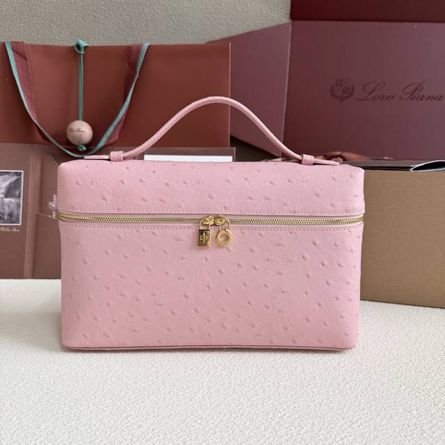 Extra Pocket L27 Gold Buckle Color: Cherry Blossom Pink This wide-mouth clutch i
