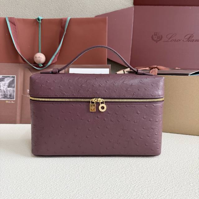 Extra Pocket L27 Gold Buckle Color: Burgundy This wide-mouthed clutch is crafted