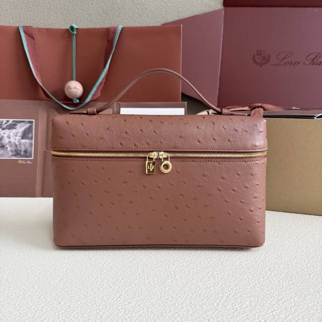 Extra Pocket L27 Gold Buckle Color: Brick Red This wide-mouthed clutch is crafte