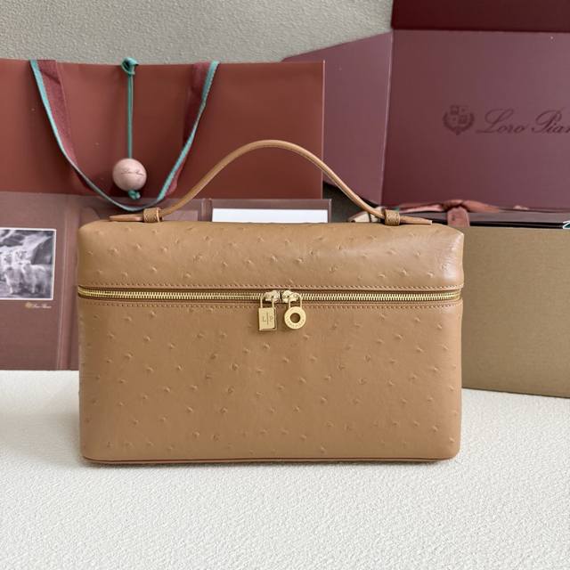 Extra Pocket L27 Gold Buckle Color: Golden Brown This wide-mouth clutch is craft
