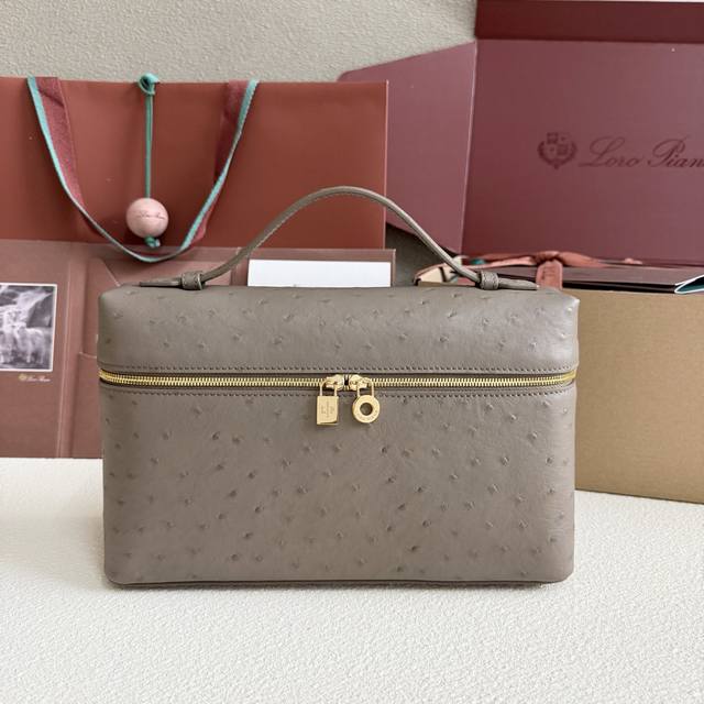 Extra Pocket L27 Gold Buckle Color: Elephant Gray This wide-mouth clutch is craf