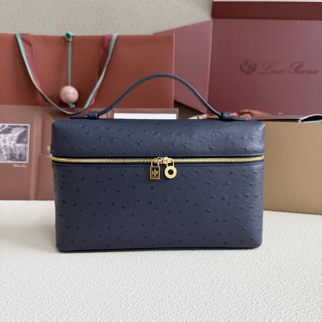 Extra Pocket L27 Gold Buckle Color: Midnight Blue This wide-mouthed clutch is cr