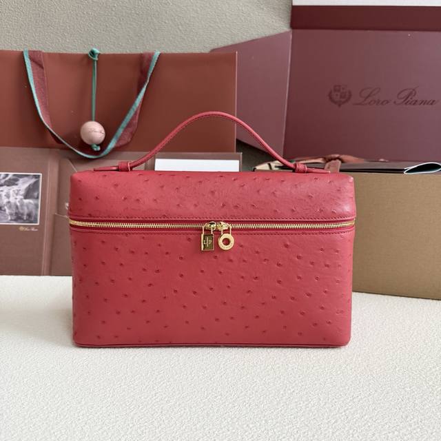 Extra Pocket L27 Gold Buckle Color: Fiery Red This wide-mouth clutch is crafted