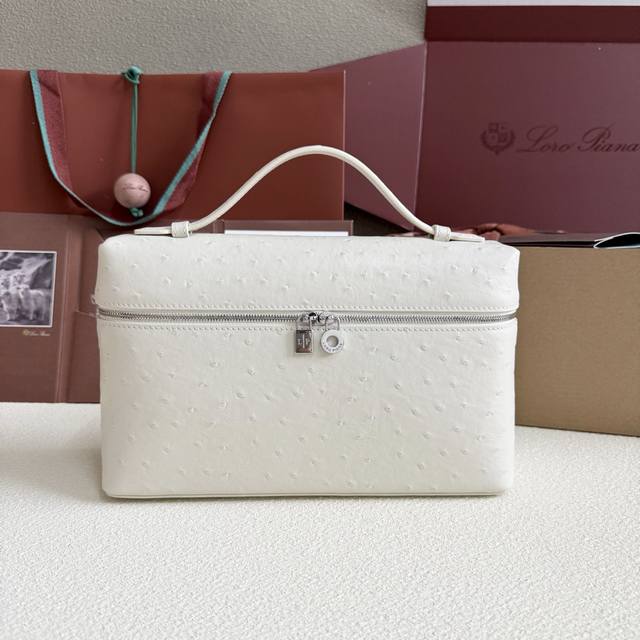 Extra Pocket L27 Silver Buckle Color: Pastel White This wide-mouthed clutch is c