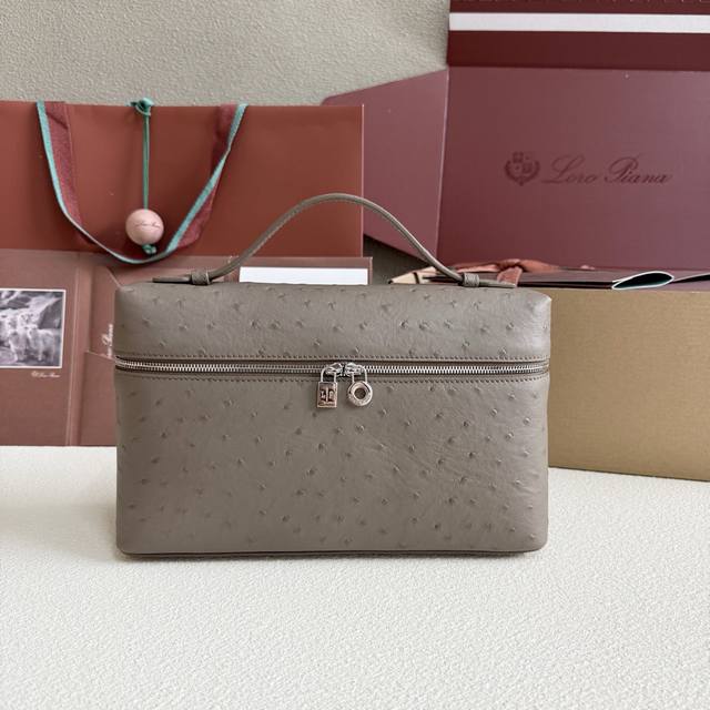 Extra Pocket L27 Silver Buckle Color: Elephant Gray This wide-mouth clutch is cr