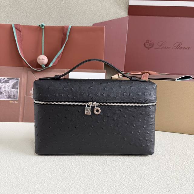 Extra Pocket L27 Silver Buckle Color: Black This wide-mouth clutch is crafted fr