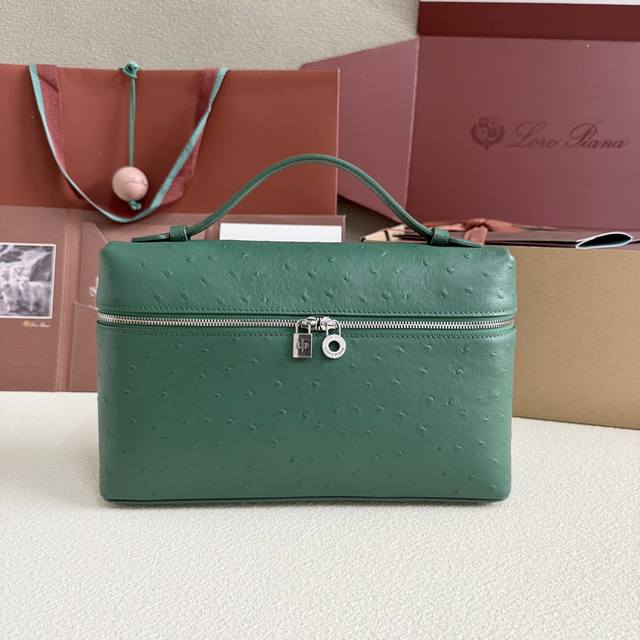 Extra Pocket L27 Silver Buckle Color: Peacock Green This wide-mouth clutch is cr