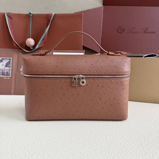 Extra Pocket L27 Silver Buckle Color: Brick Red This wide-mouth clutch is crafte