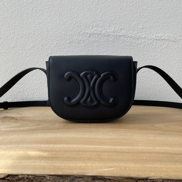 This top-tier, original spring/summer Folco saddle bag is about the same size as