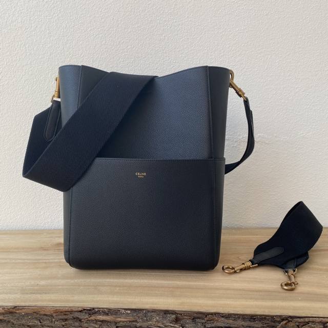 original Cel_Ine Sangle bucket bag with a single shoulder strap and a wide bucke
