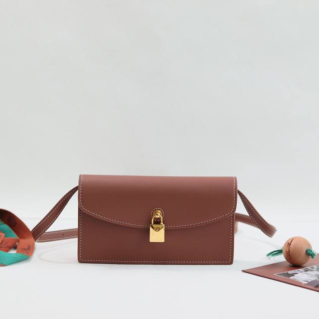 Loro Piana Pickette Clutch Color: Maroon Palm This elegant clutch from the iconi
