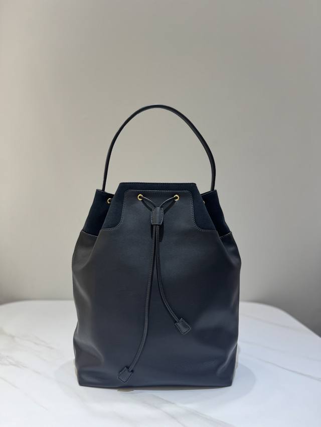 Backpack features a classic black fabric and leather combination. It comes with