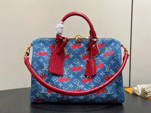 Original N87627 blue denim embroidered cherry pillow bag paired with a crocodile