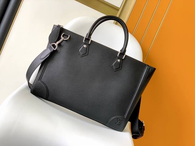 M30810 Black The new Slim Briefcase, crafted from finely textured Taga leather,