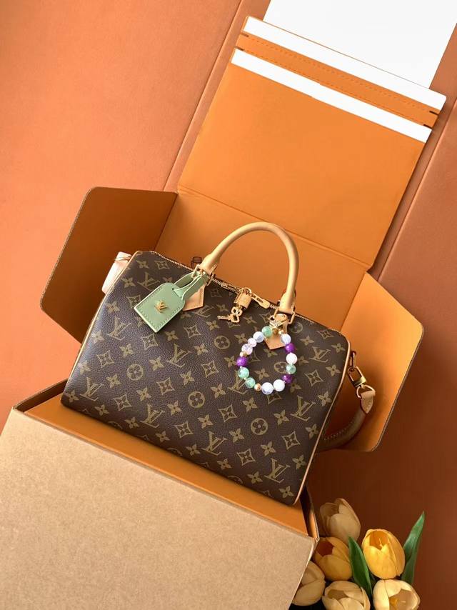 Extra-Grade Steel. M 7 This Speedy Soft 30 Lucky bag features Monogram canvas wi