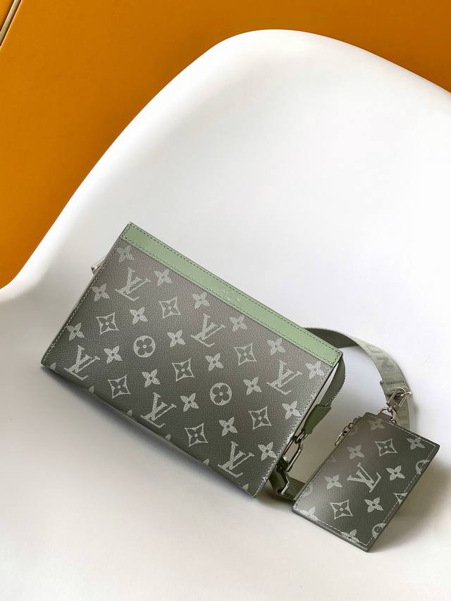 M81124 Alpha Wearable Wallet with a gradient green chip is crafted from Monogram